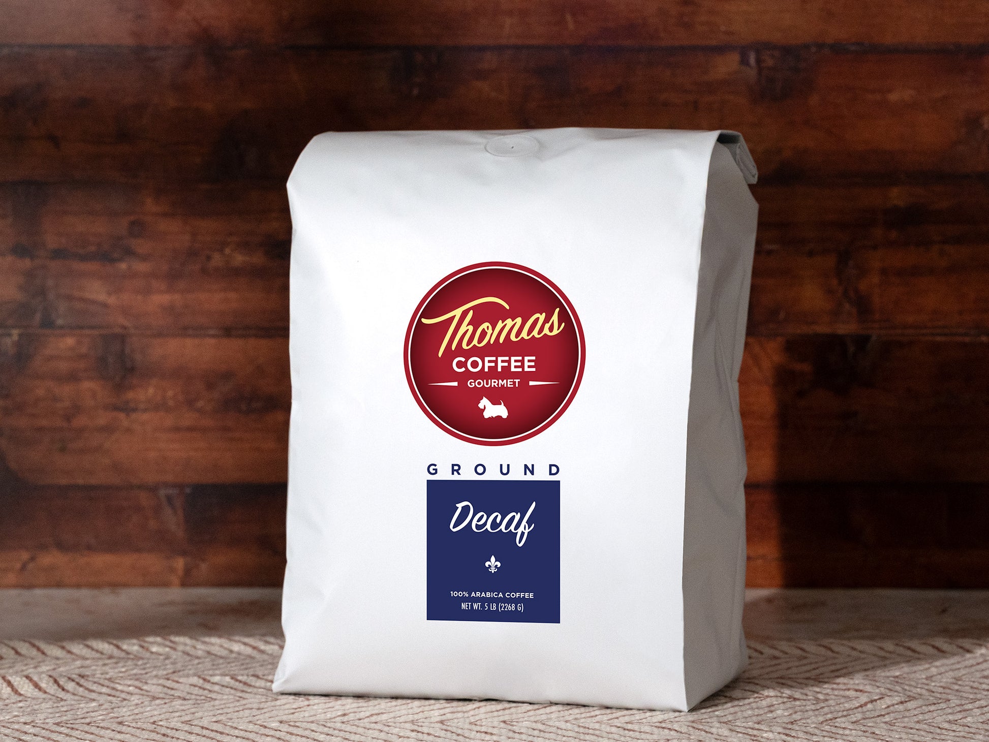 White coffee bag with 'Thomas Coffee' label on a wooden background