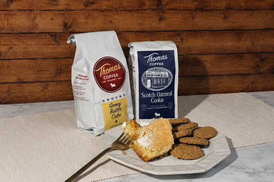 Gooey Butter Cake and Scotch Oatmeal Cookie bags next to a plate of each item