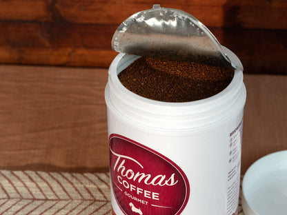 Thomas Coffee Premium Blend Can Product Photo - View of coffee grounds in a can on a wooden background